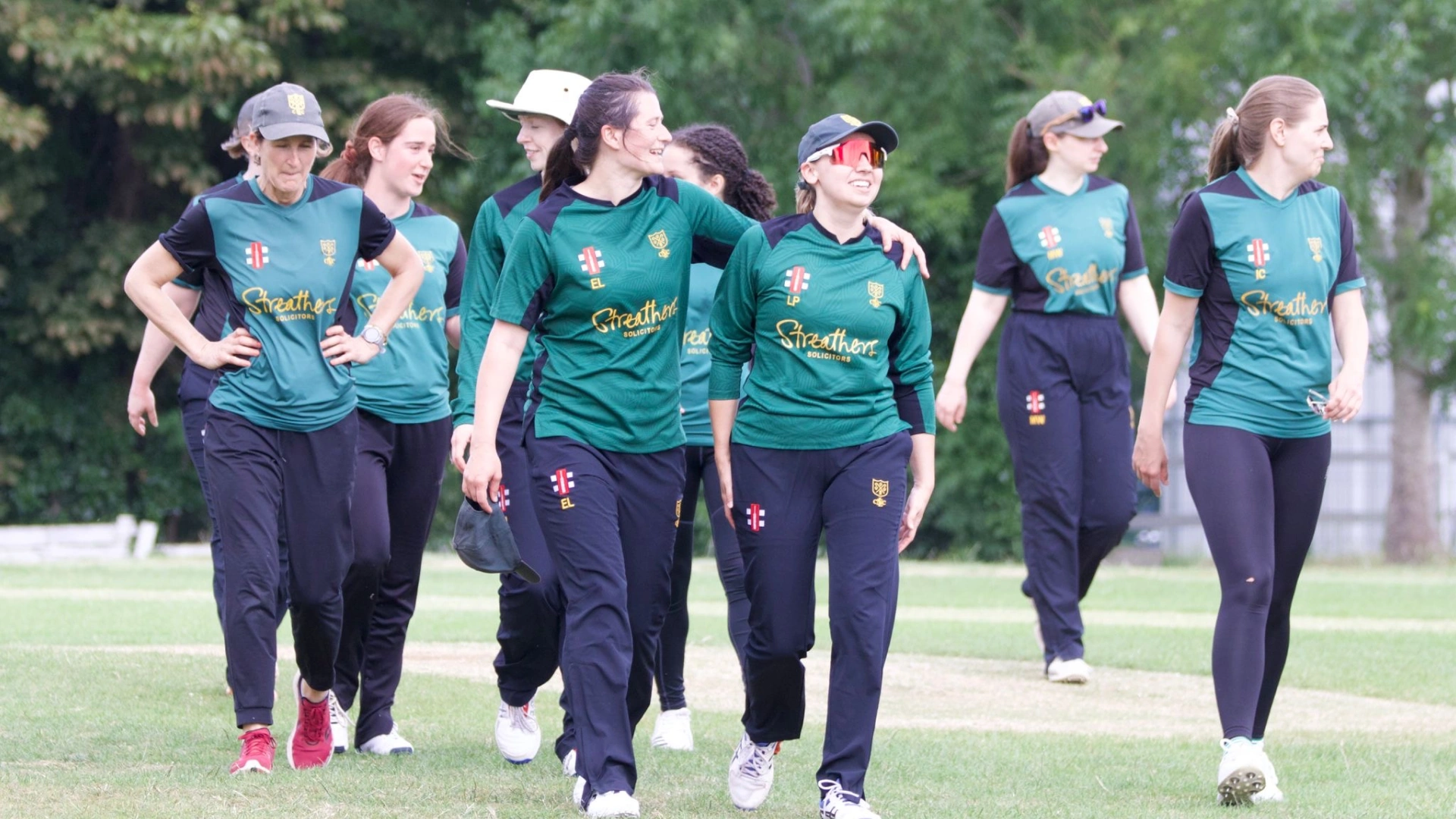 North London CC Women's team walking off the field victorious and all smiles